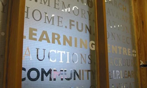 Translucent lettering and privacy film on interior glass doors