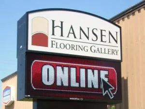 Existing roadside cabinet sign with separate business and changeable-message panels