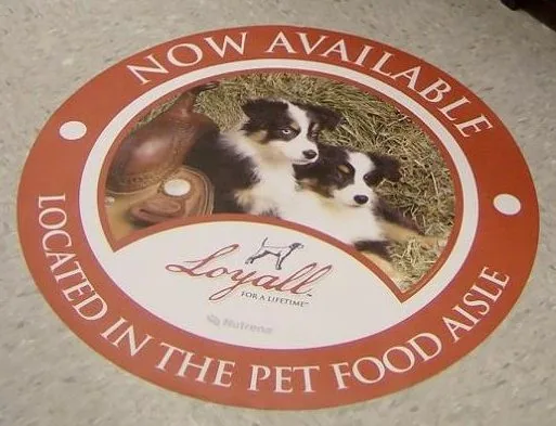 Circular pet food promotion graphic on a shop floor